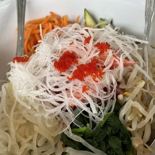 a bowl of noodles and vegetables