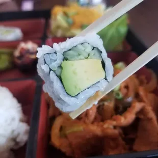 a sushi roll with avocado