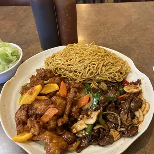 a plate of noodles and beef