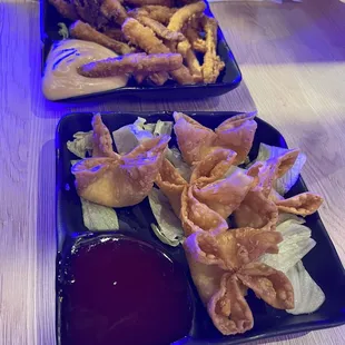two plates of fried food
