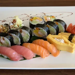 Shrimp tempura, futo maki, sake sushi, maguro sushi and tamago sushi.