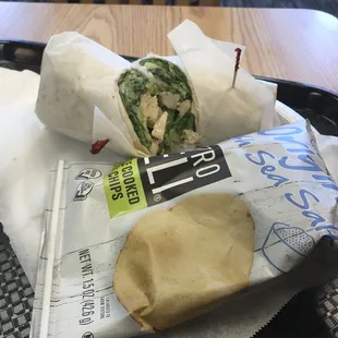 Chicken Caesar Wrap w chips, a pickle and a drink.