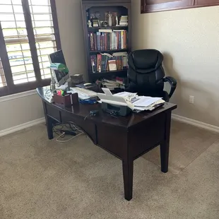 Office desk and book shelf.