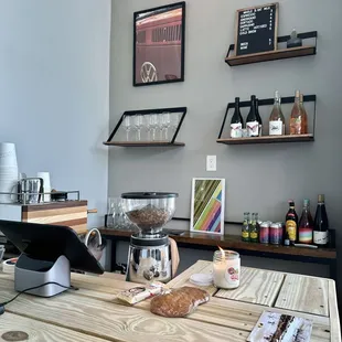 a coffee shop counter with a coffee grinder