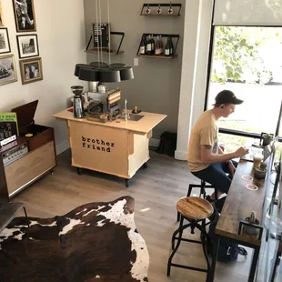 a man sitting at a table in a coffee shop
