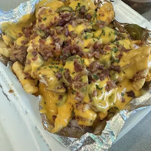 Loaded fries with fried chicken, bacon, jalapeños- so good!