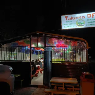 the outside of a restaurant at night