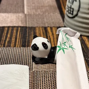 a panda figurine on a table