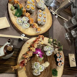 two plates of sushi on a table