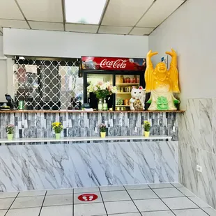 a counter with a coca cola sign on it