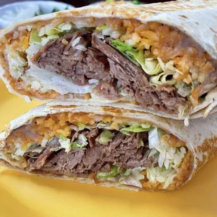 1 lb Burrito filled with rice, beans, cheese, lettuce, sour cream and your choice of meat.!