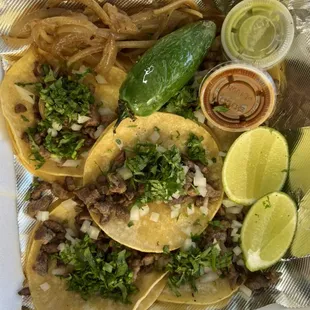 5 mini tacos Asada or Pastor and a soda