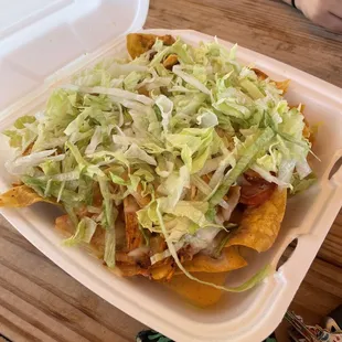 Chicken Nachos ...There's a lot of stuff under the lettuce I promise ;)