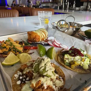 Chile relleno taco, Queso Asado &amp; Rajas taco, calabaza taco, and a chicken tinga taco