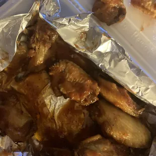 chicken wings wrapped in foil