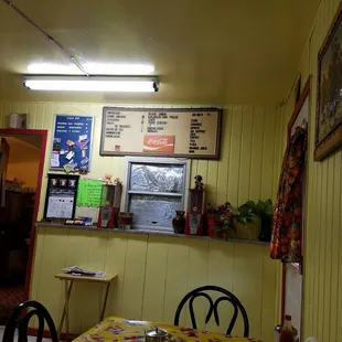 a yellow dining room with a yellow table and chairs