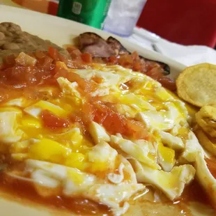 Huevos rancheros sorry i forgot to take pic before breaking them...they were three in total...