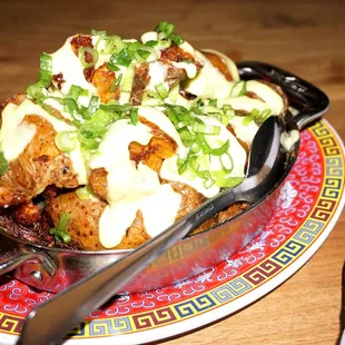 Papas Bravas: fried potatoes, oregano butter, spicy tomato sauce, garlic mayo ($11).