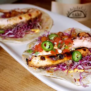 Tako Tacos: grilled octopus, harissa aioli, fried chickpeas, charred jalapeno pico ($23 for 2).