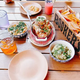 Clockwise: equites/elotes dip, pataas bravas, guac &amp; chips (all vegetarian)