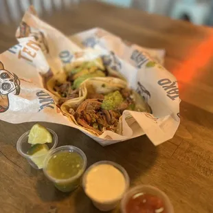 a taco and condiments on a table