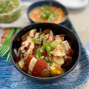 two bowls of food on a table