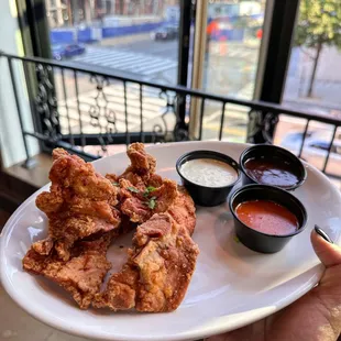 Boneless Chicken wings with a side of Ranch, Buffalo and BBQ Sauce