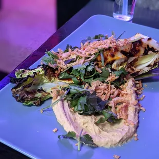 Grilled lettuce with hummus. Surprisingly really really delicious