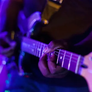 a person playing a guitar
