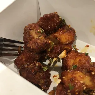 a fork in a box of food