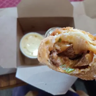 Bulgogi eggroll with Queso sauce.