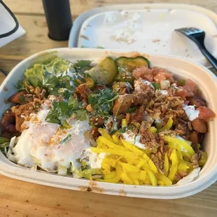 Chicken rice bowl with all toppings and add-ons for under $20