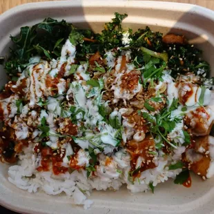 a bowl of rice and greens