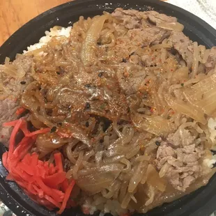 Gyudon: thin-sliced beef with onion on rice. Sauce has ginger.