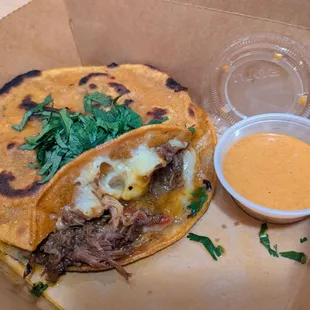 Melita with chipotle Sriracha sauce on the side