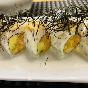 a plate of sushi rolls