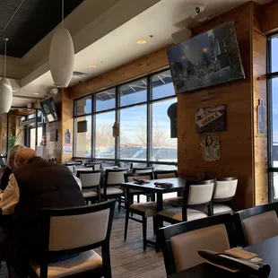 people sitting at tables in a restaurant