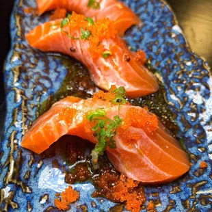 a close up of a plate of sushi