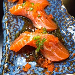 a close up of a plate of sushi