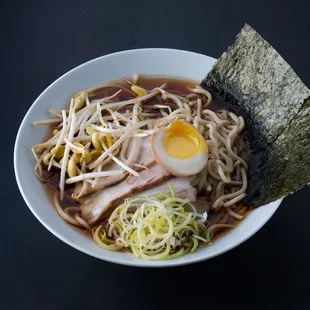 an overhead view of a bowl of ramen