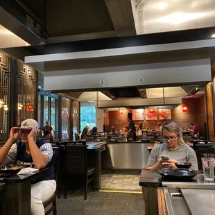 two people sitting at a table in a restaurant