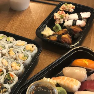 a variety of sushi dishes on a table