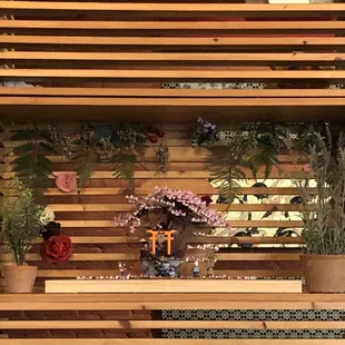 a small shrine made of wooden planks