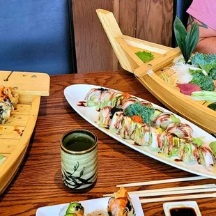 a wooden boat with sushi on it