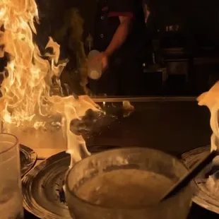 The chef lit every plate on fire with his hand!