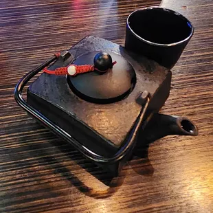 Iron teapot of green tea.