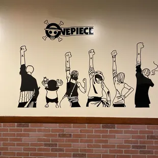 a mural of a group of people raising their hands