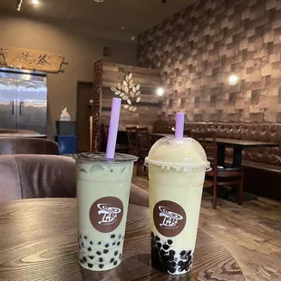 Matcha latte with almond milk and boba Mango smoothie with boba