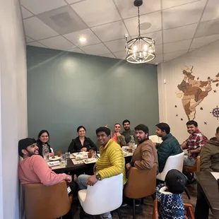 a group of people sitting around a table
