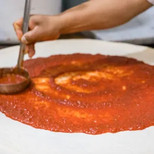 a person making a pizza